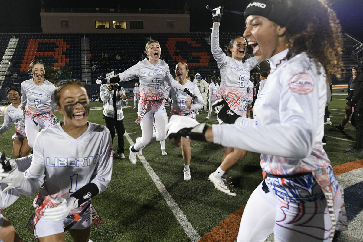 Liberty players celebrate after defeating Bishop Gorman in the 5A flag football state quarterfi ...