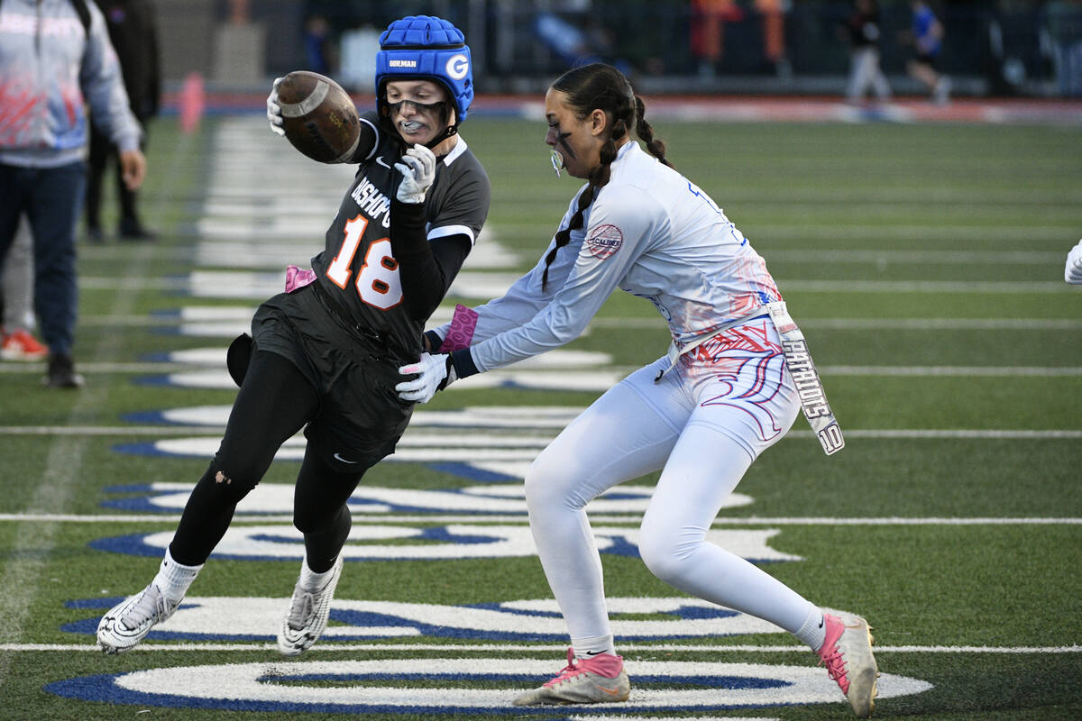 Bishop Gorman’s Grace Yager is tackled by Liberty safety Nai’a Pomaikai during th ...