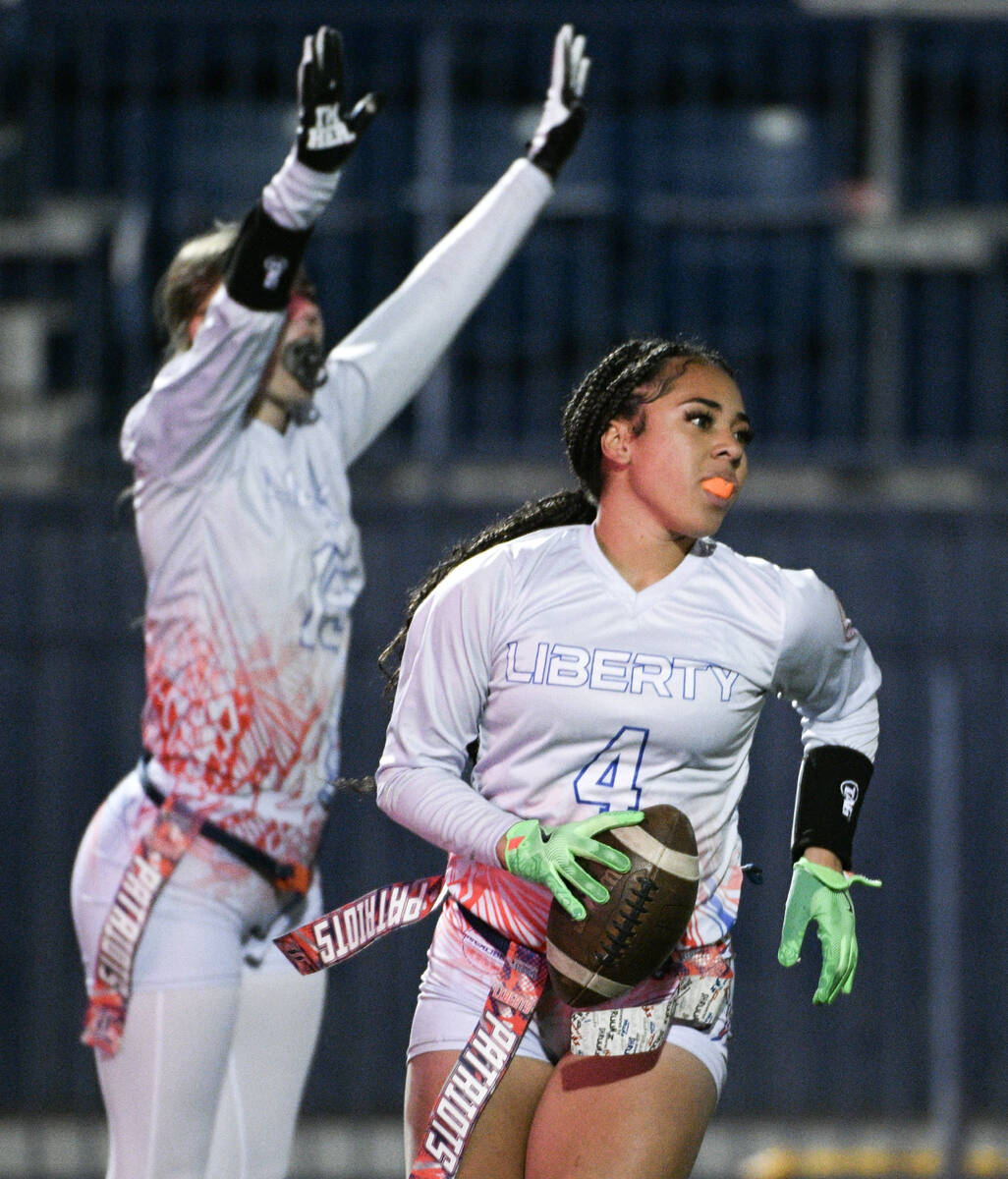 Liberty’s Brinlee Yurek celebrates teammate Ki'lolo Westerlund’s touchdown during the 5A fl ...