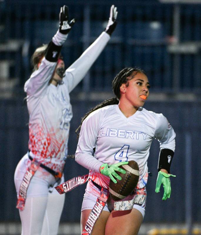 Liberty’s Brinlee Yurek celebrates teammate Ki'lolo Westerlund’s touchdown during the 5A fl ...