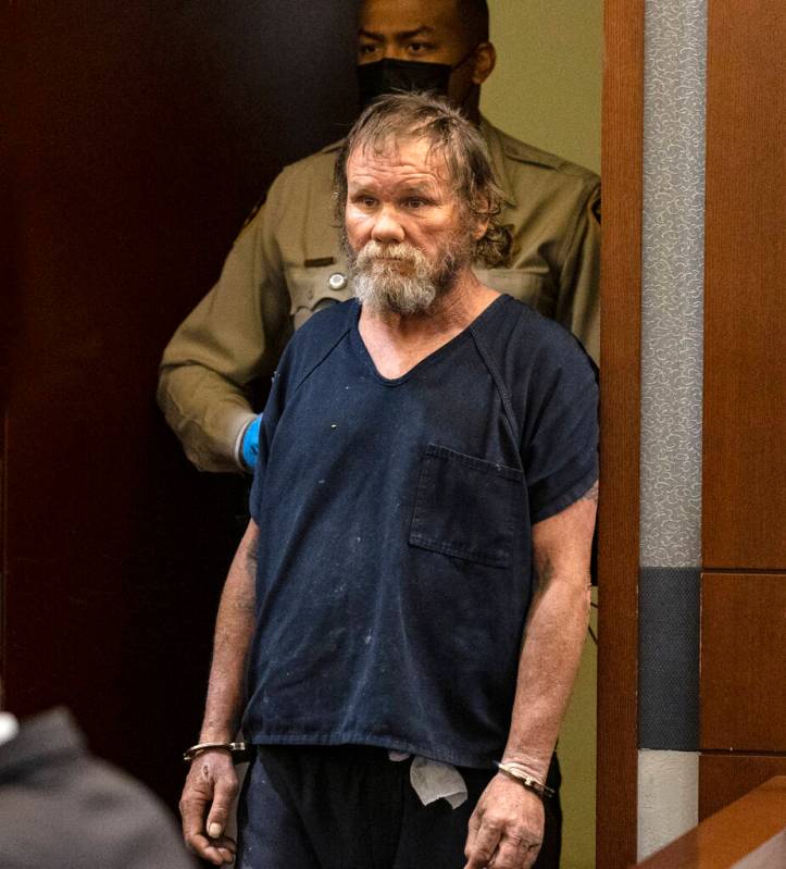 Freddy Allen, accused of fatally stabbing a police officer on the Strip, lead into the courtroo ...