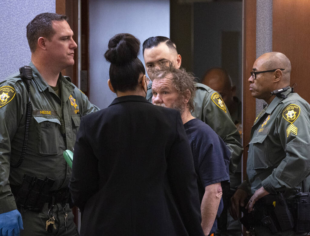 Freddy Allen, center, who is accused of fatally stabbing an off-duty officer on the Strip, talk ...