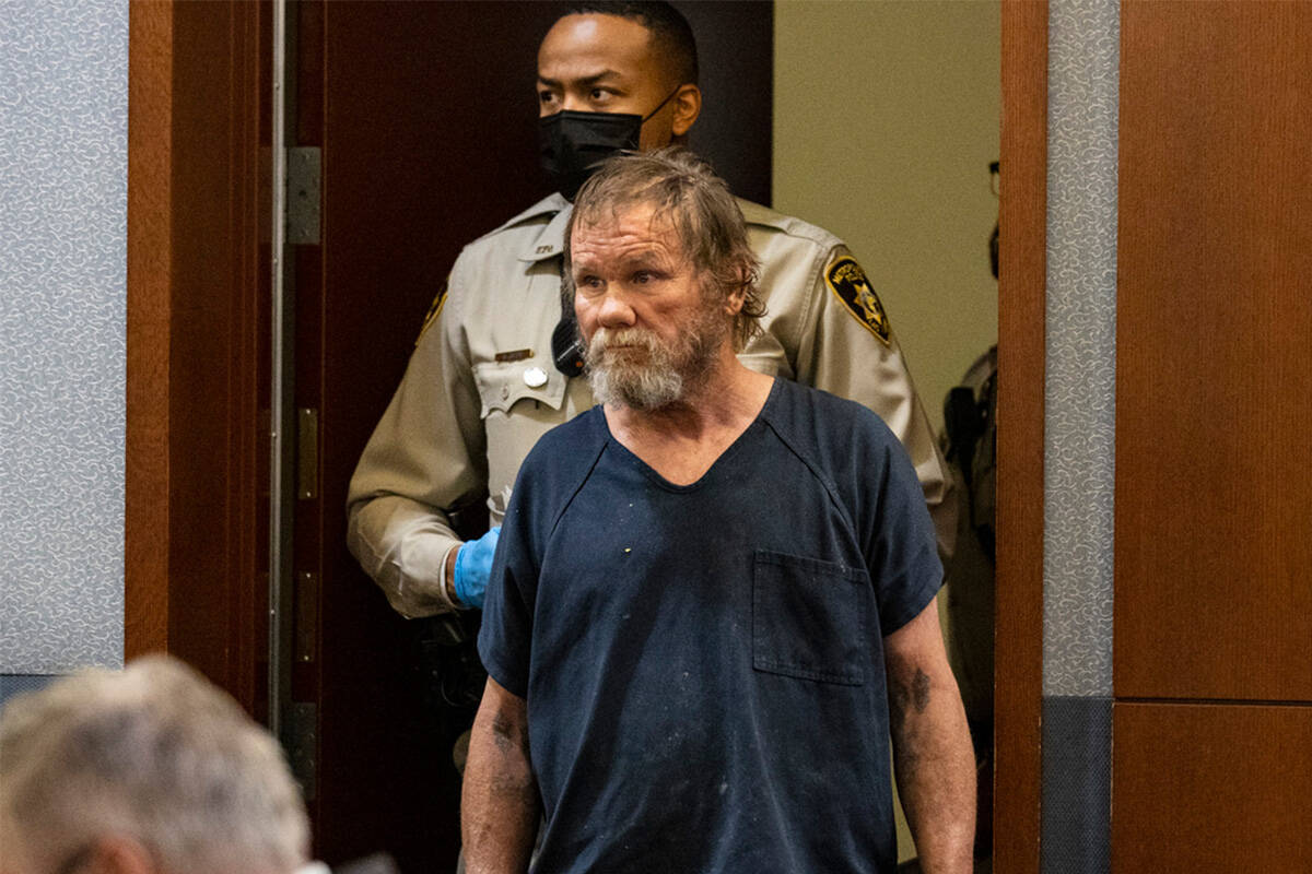Freddy Allen, accused of fatally stabbing a police officer on the Strip, lead into the courtroo ...
