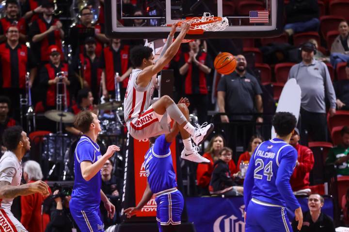 UNLV guard Jailen Bedford (14) dunks the ball against Air Force during the first half of a bask ...