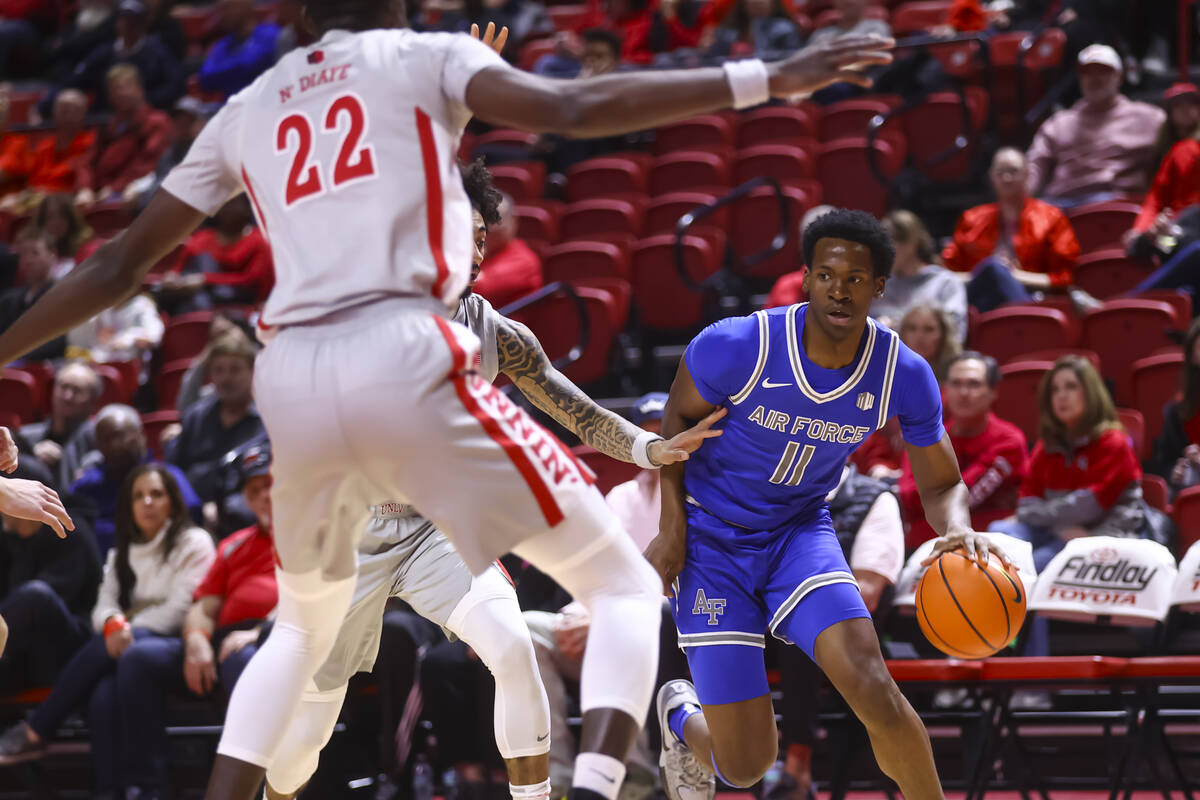 Air Force guard Byron Brown (11) drives the ball against UNLV during the first half of a basket ...