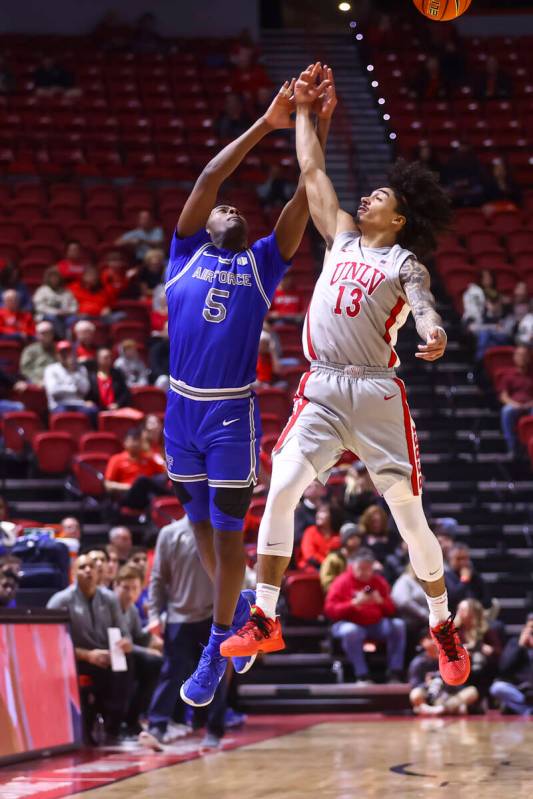 UNLV guard Brooklyn Hicks (13) tries to intercept a pass intended for Air Force guard Ethan Tay ...