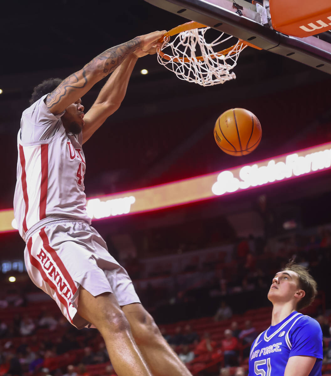 UNLV forward Jeremiah Cherry dunks against Air Force during the second half of a basketball gam ...
