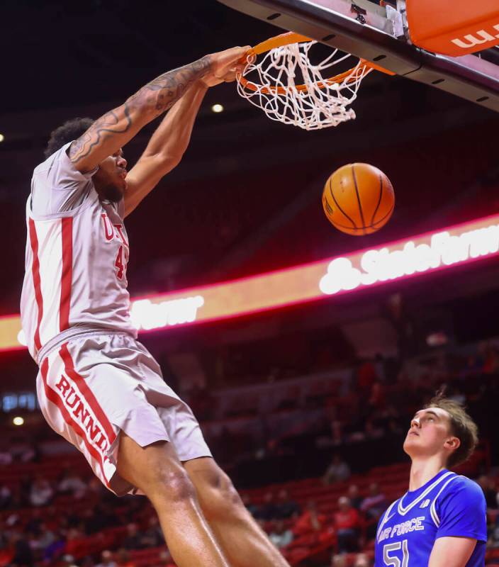 UNLV forward Jeremiah Cherry dunks against Air Force during the second half of a basketball gam ...