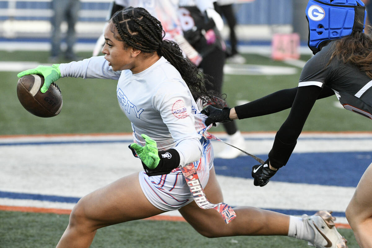 Liberty wide receiver Kilolo Westerlund escapes a tackle during the 5A flag football state quar ...