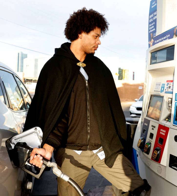 Lee Overton pumps gas at Rebel gas station on Tropicana Avenue, on Wednesday, Feb. 12, 2025, in ...