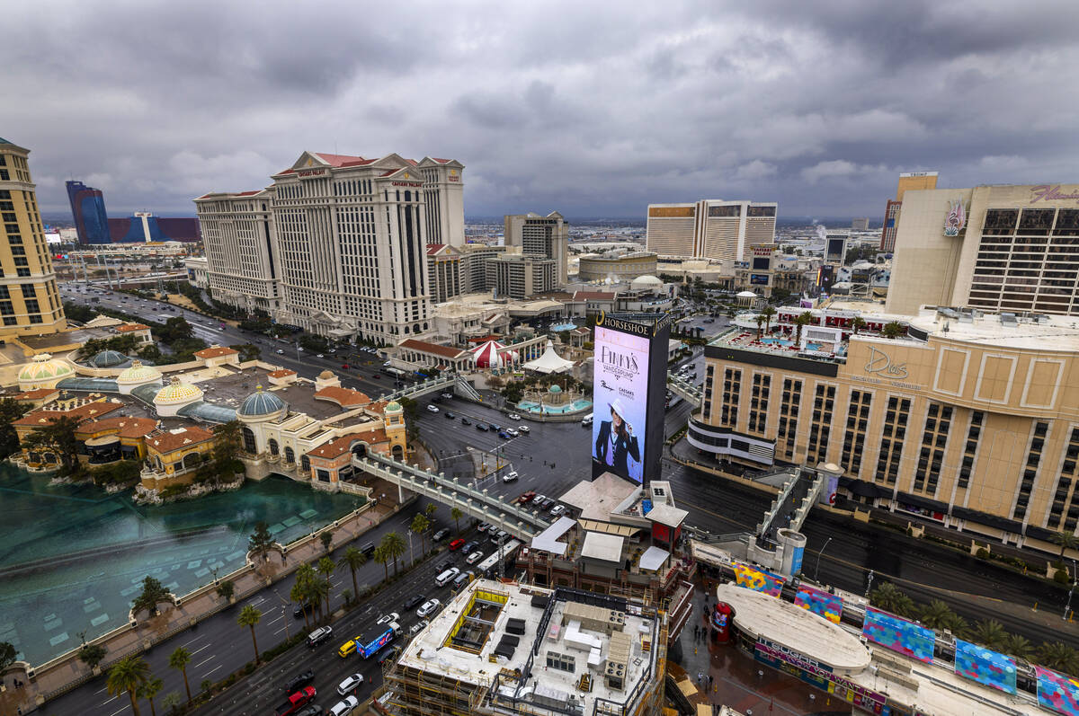 The sky is dark and cloudy about the Strip and beyond as rain moves through the valley on Thurs ...