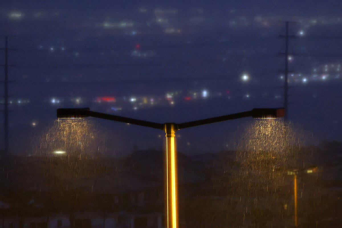 The Las Vegas Valley is obscured this morning from fog and rain as seen from Lake Mead Parkway, ...