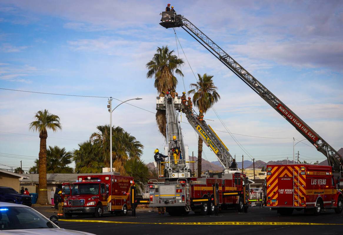 Las Vegas police and firefighters, with assistance from Clark County Fire Department, respond t ...