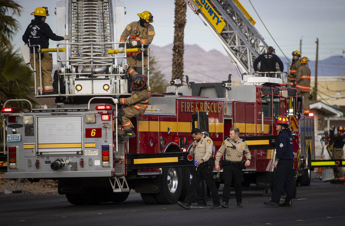 Las Vegas police and firefighters, with assistance from Clark County Fire Department, respond t ...