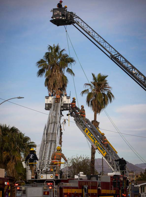 Las Vegas police and firefighters, with assistance from Clark County Fire Department, respond t ...