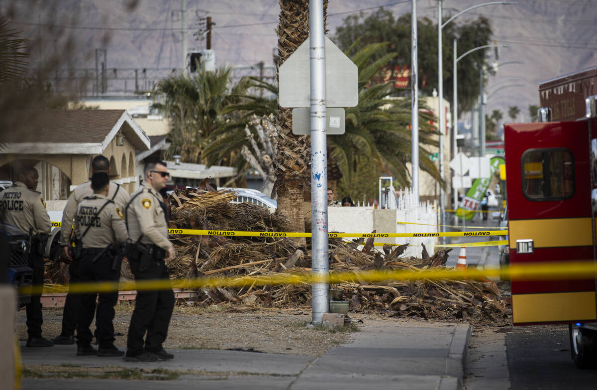 Las Vegas police and firefighters, with assistance from Clark County Fire Department, respond t ...