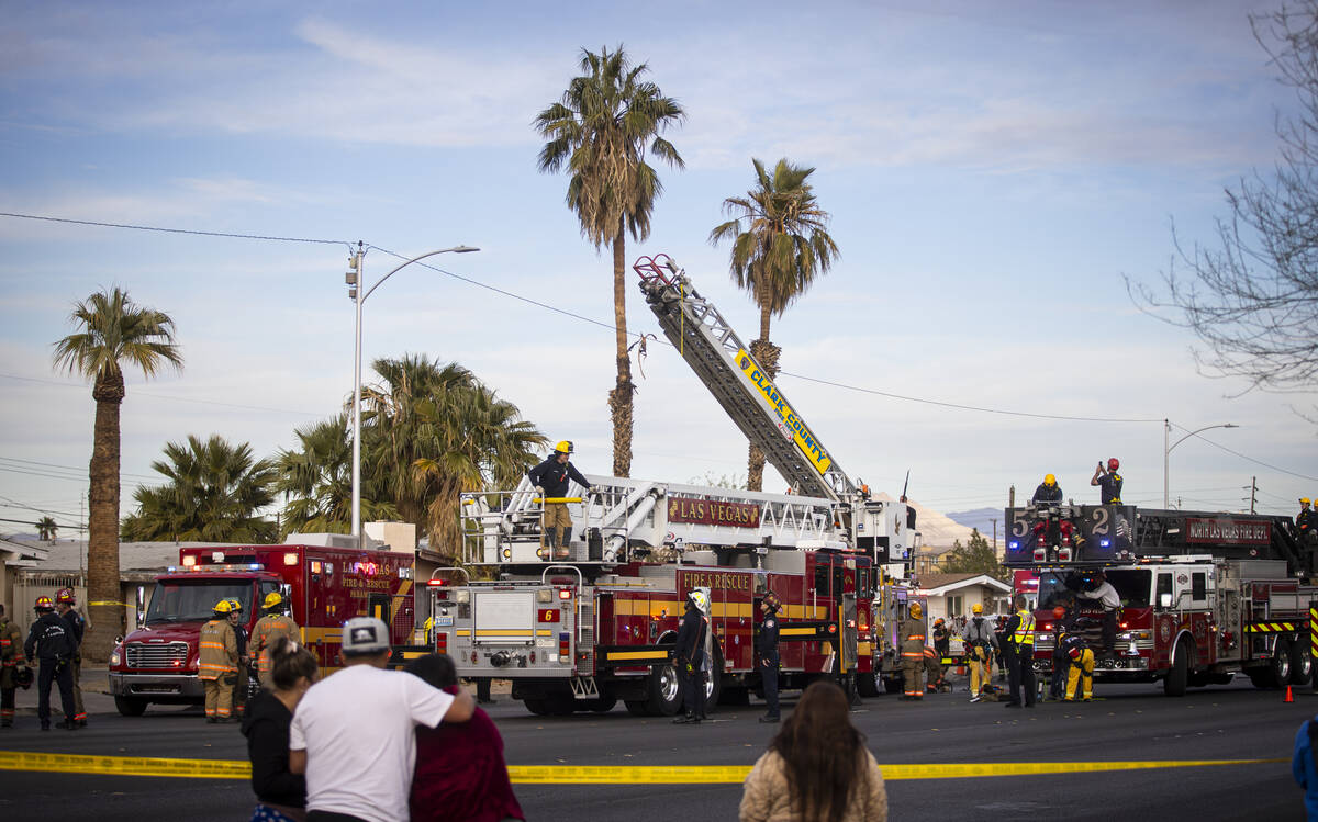 Las Vegas police and firefighters, with assistance from Clark County Fire Department, respond t ...