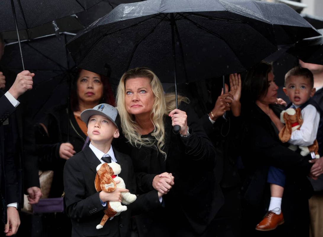 Graysen, 9, son of fallen North Las Vegas police officer Jason Roscow, watches a flyover with a ...