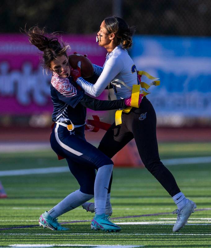Coronado safety Mia Schlachter (7) collides with Sierra Vista runner Mary Agnes Kahawaii Pula ( ...
