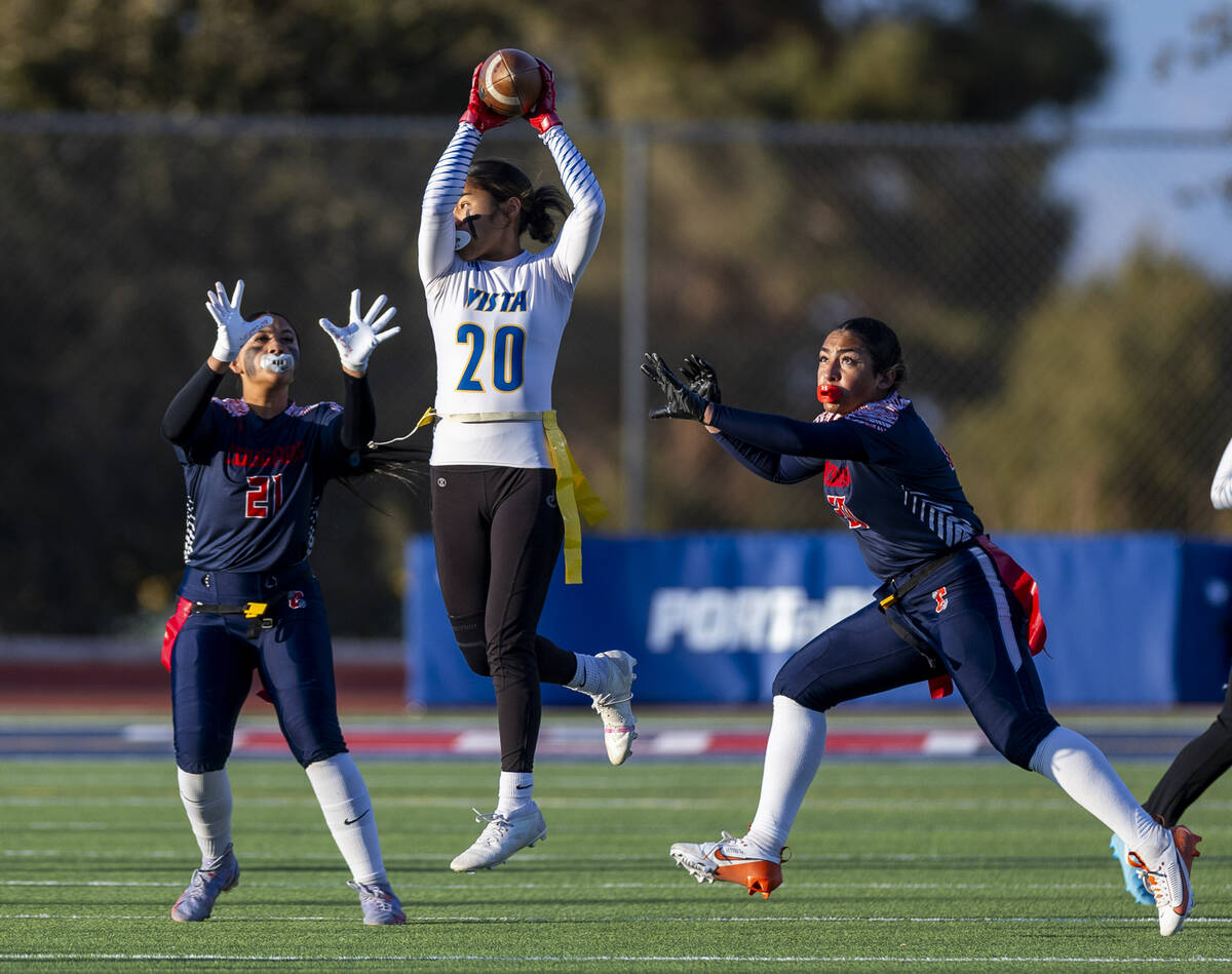 Sierra Vista runner Mary Agnes Kahawaii Pula (20) elevates for a catch over Coronado linebacker ...