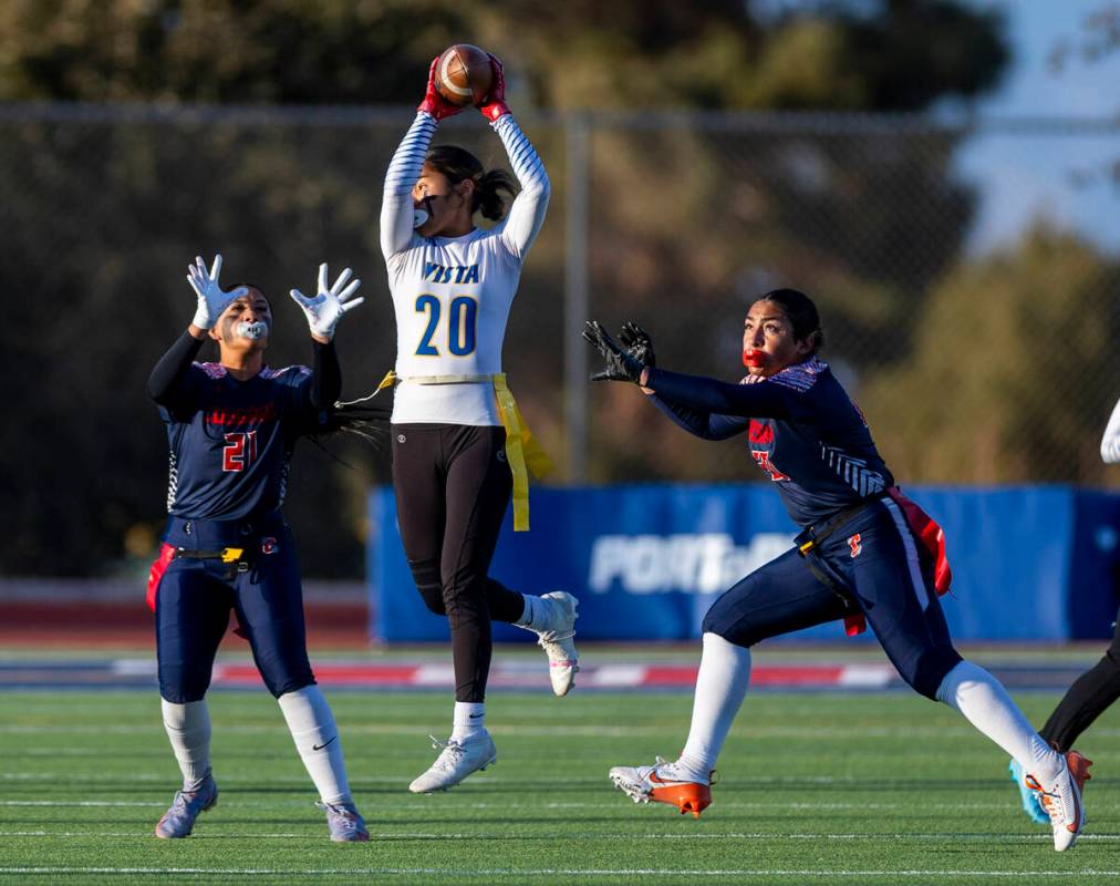 Sierra Vista runner Mary Agnes Kahawaii Pula (20) elevates for a catch over Coronado linebacker ...