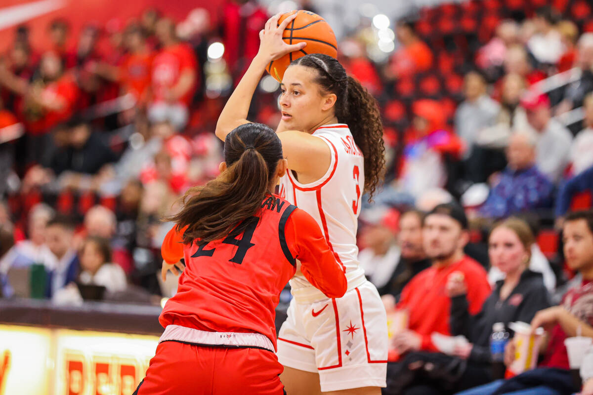Lady Rebels guard Kiara Jackson (3) looks for an open teammate during a women’s basketba ...