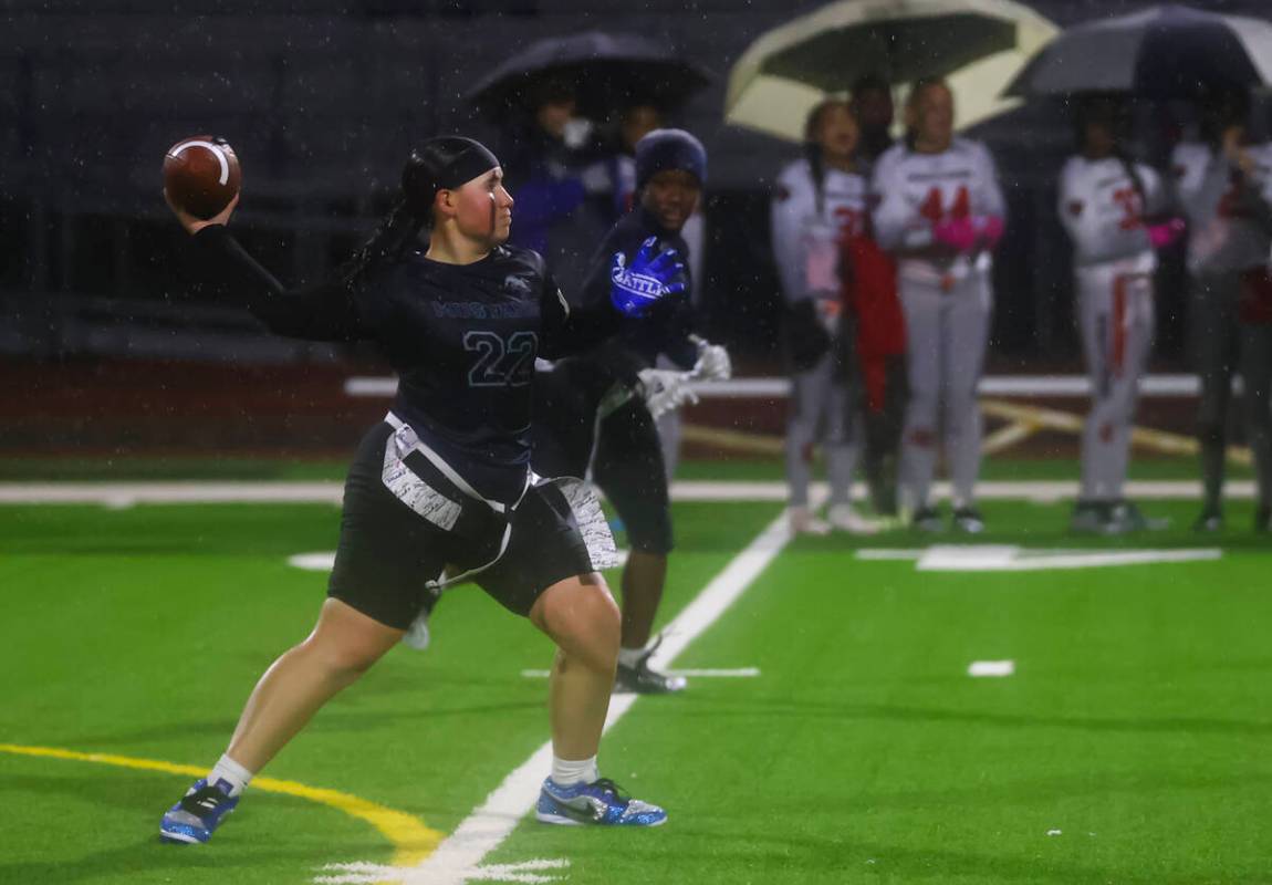 Shadow Ridge's Aubree Davis (22) throws a pass during a 5A state semifinal flag football game a ...