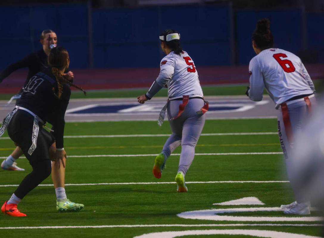 Desert Oasis' Akemi Higa (5) runs the ball to score a touchdown on an interception against Shad ...