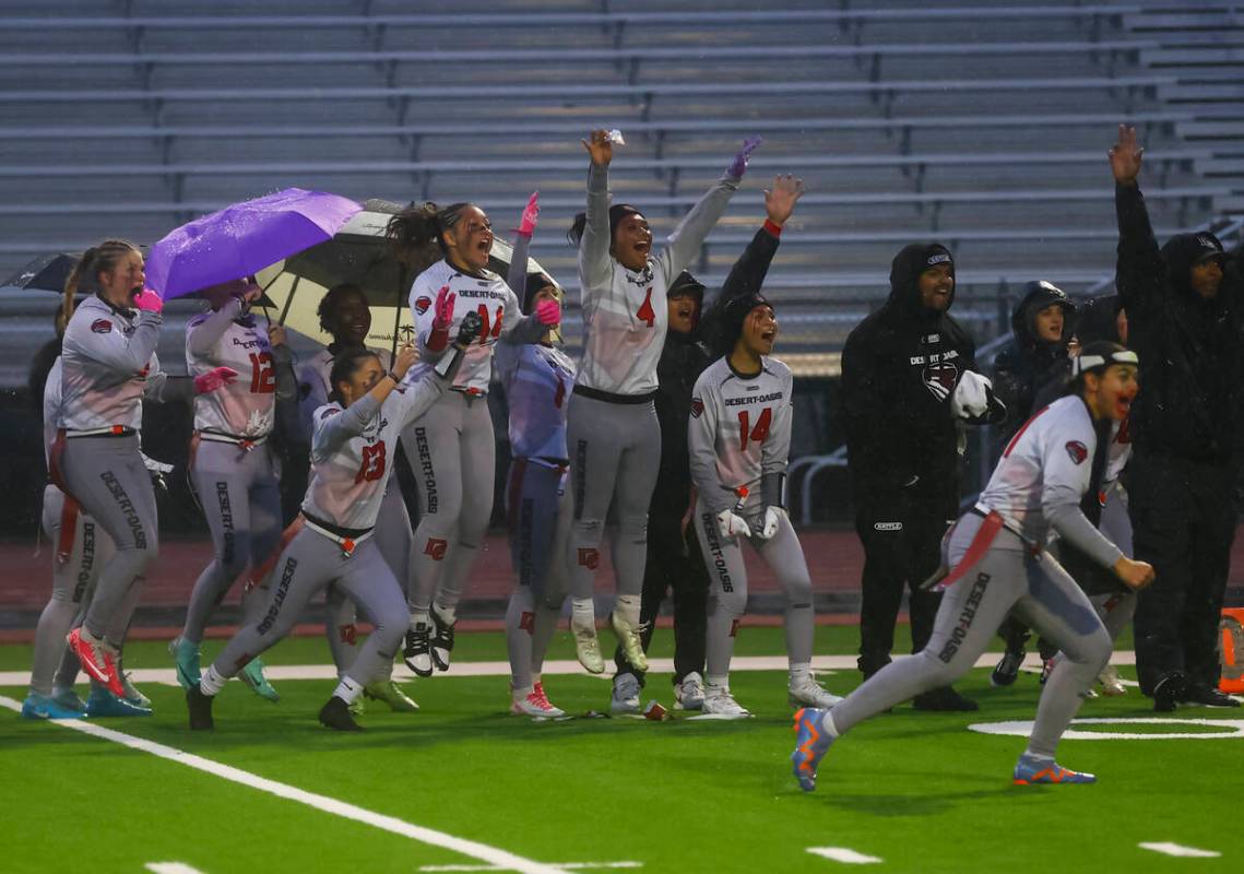 Desert Oasis players celebrate a touchdown during a 5A state semifinal flag football game at Sh ...