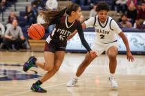 Faith Lutheran point guard Caylyn Young (5) dribbles the ball as shooting guard Avery Freeman ( ...
