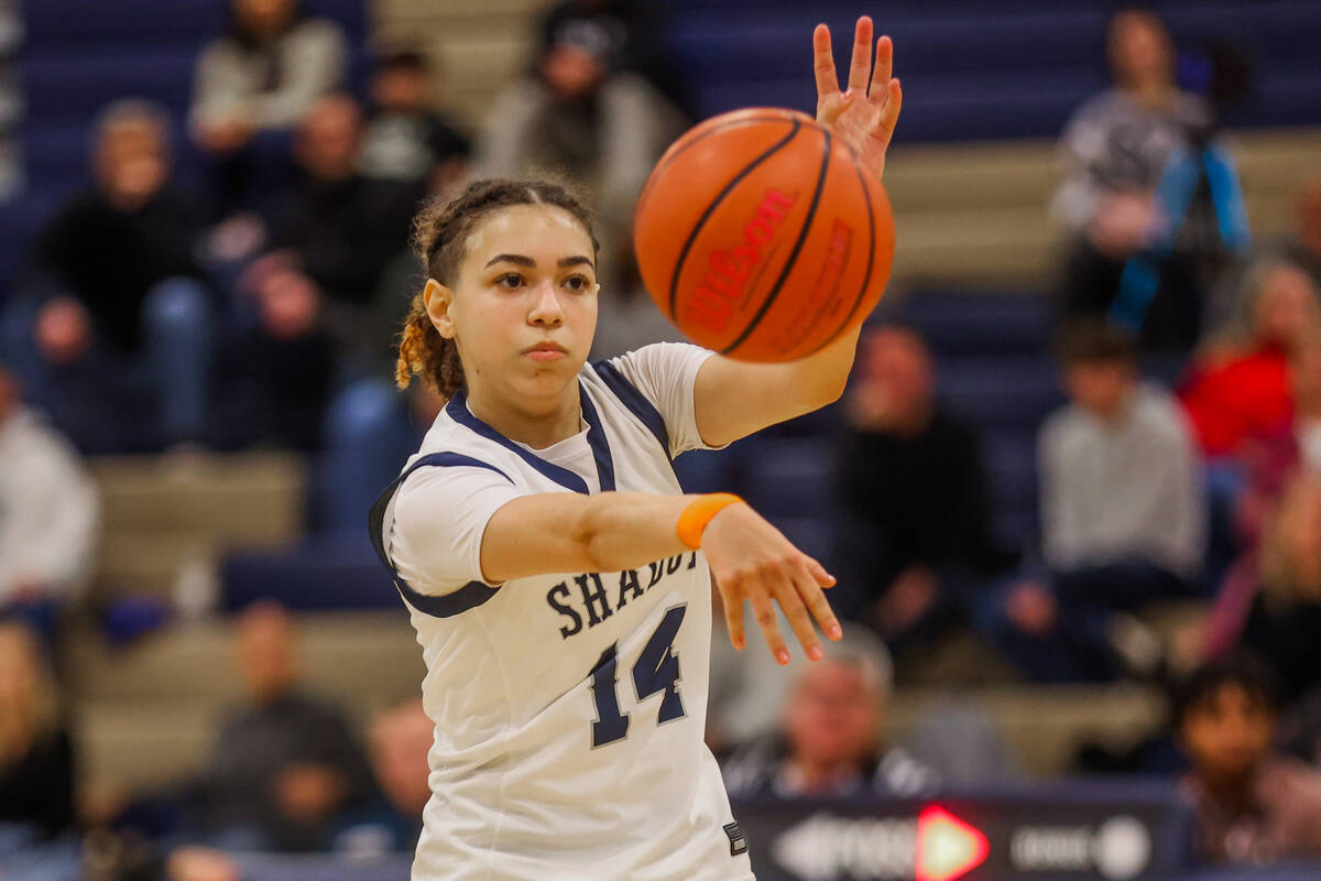 Shadow Ridge point guard Chanel Gafeney (14) passes the ball during a 5A girls state quarterfin ...