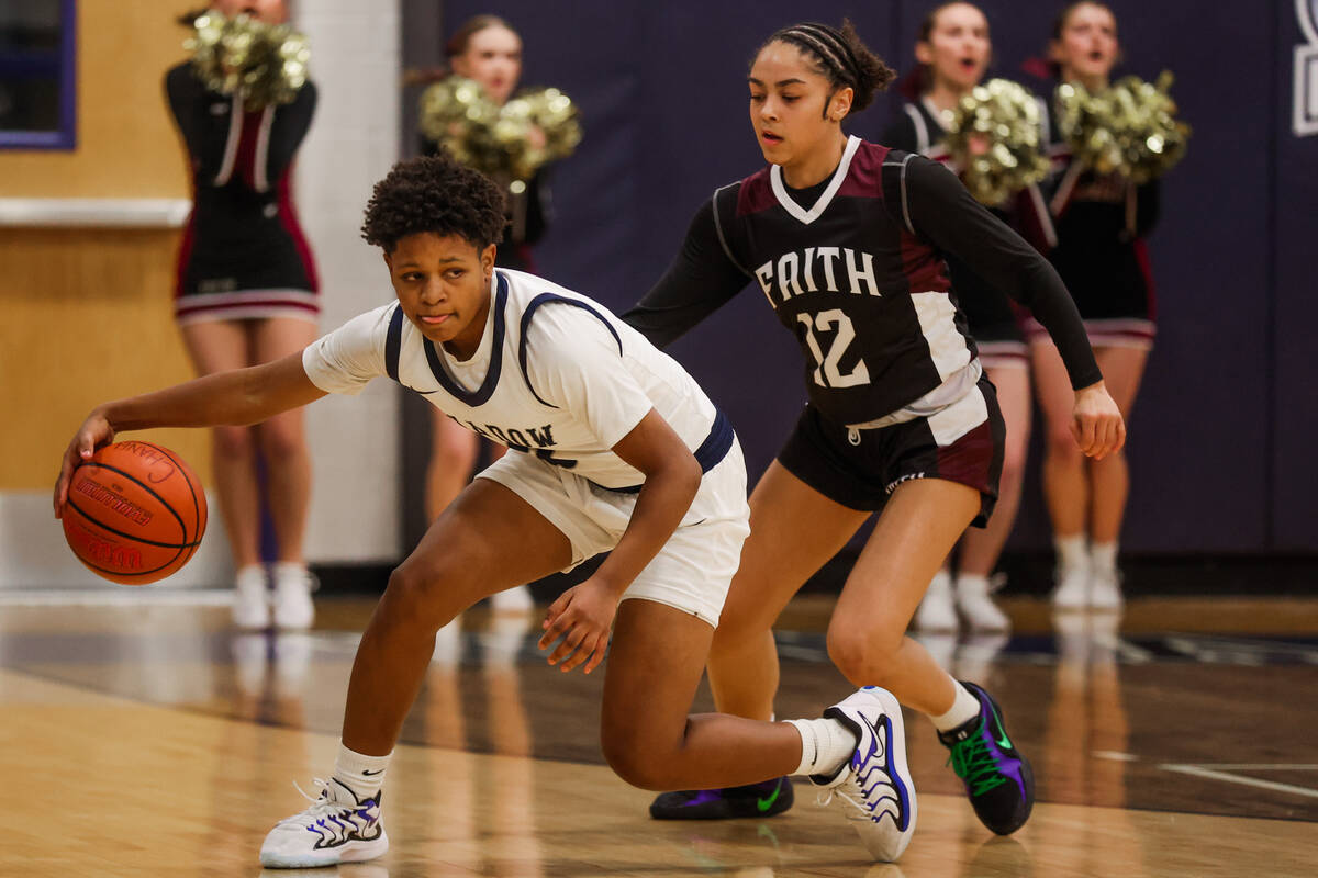 Shadow Ridge shooting guard Avery Freeman (2) dribbles the ball as Faith Lutheran guard Aliyah ...