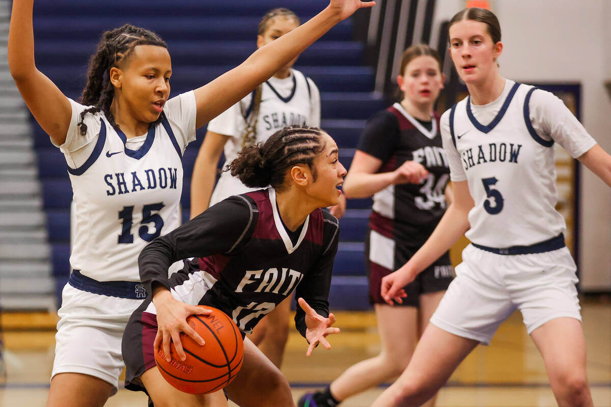 Faith Lutheran guard Aliyah Maese (12) dribbles the ball to the hoop during a 5A girls state qu ...