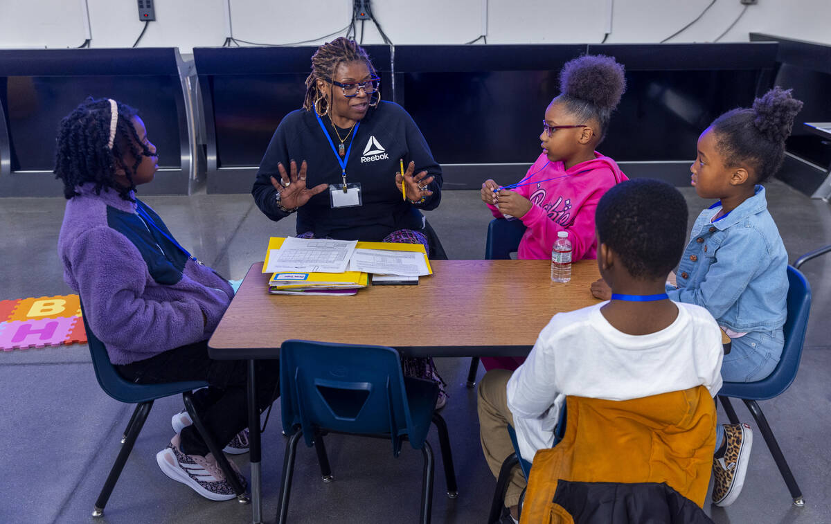 Teacher Tracey Warren works with second graders as the Southern Nevada Black Educators Initiati ...