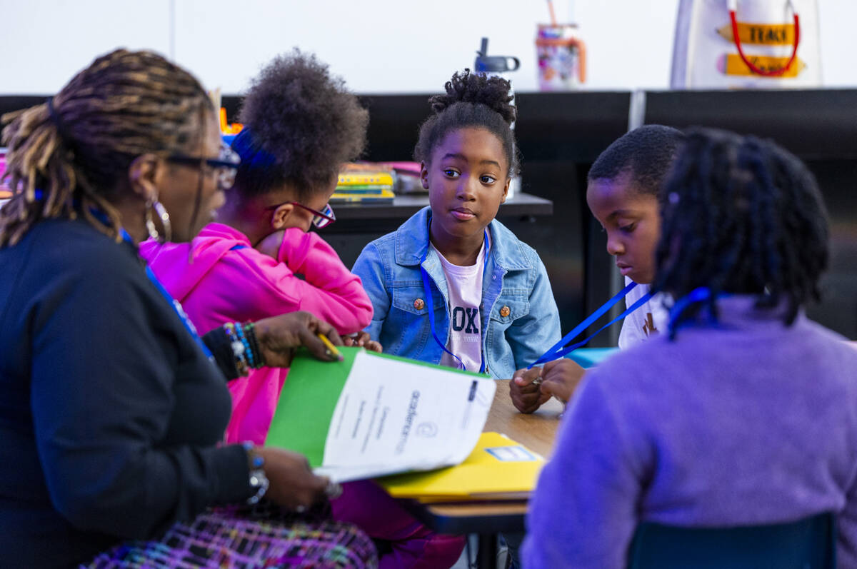 Student Raelyn Johnson listens to Teacher Tracey Warren working with second graders as the Sout ...