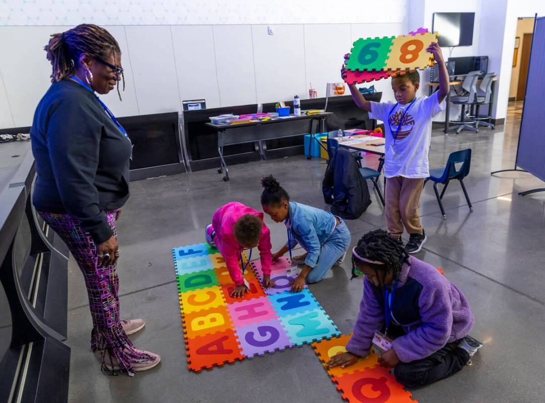 Teacher Tracey Warren observes her second graders assembling the alphabet and numbers as the So ...