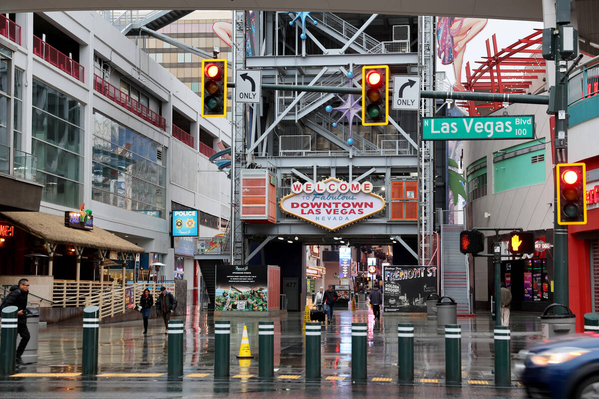 Pedestrians walk at the Fremont Street Experience at Las Vegas Boulevard in Las Vegas Thursday ...