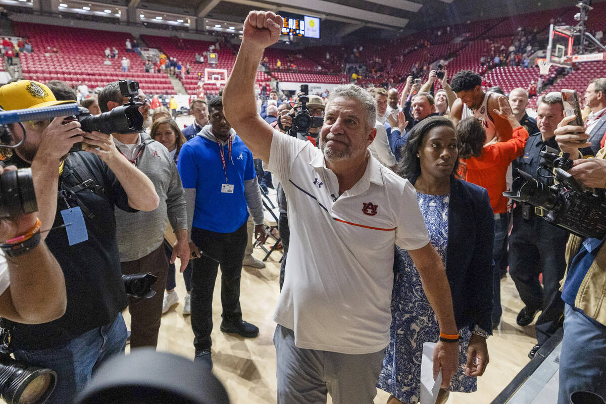 Auburn head coach Bruce Pearl celebrates after a win over Alabama at an NCAA college basketball ...