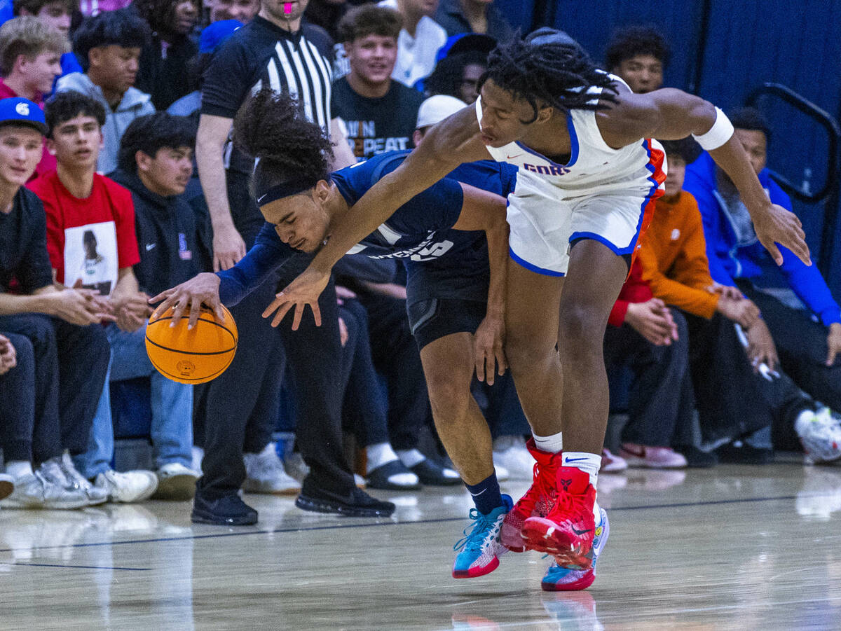 Centennial's Jayonni Durrough (25) is fouled on a reach in by Bishop Gorman's Jett Washington ( ...