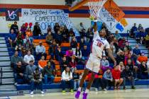 Bishop Gorman's Nick Jefferson (10) scores on a fast break against Centennial during the first ...