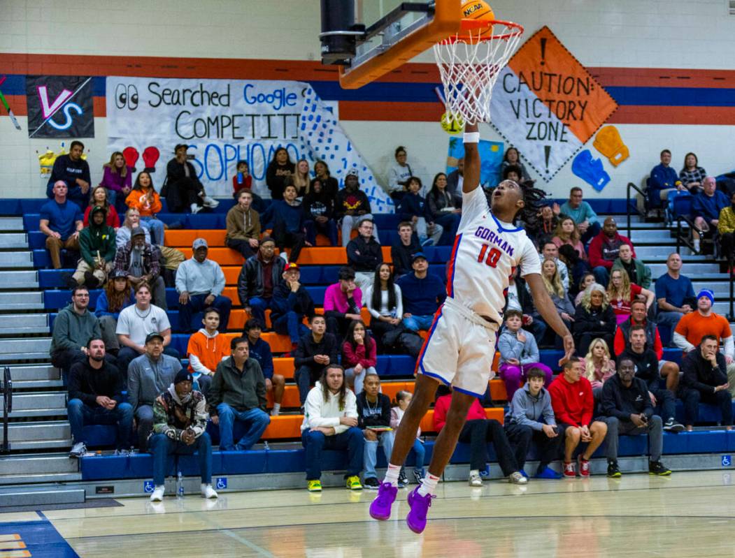 Bishop Gorman's Nick Jefferson (10) scores on a fast break against Centennial during the first ...
