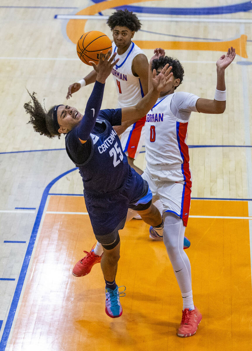 Centennial's Jayonni Durrough (25) attempts to shoot after contact with Bishop Gorman's Kingsto ...