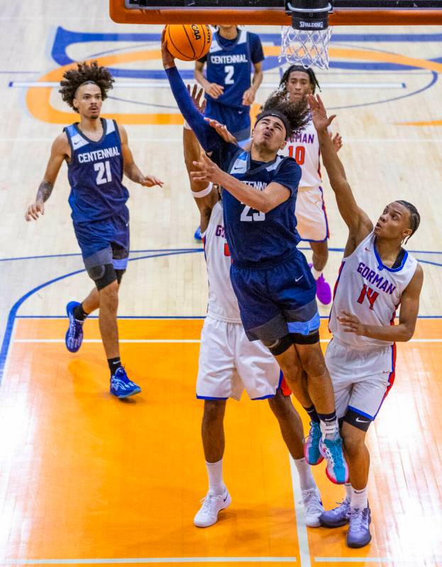 Centennial's Jayonni Durrough (25) gets inside of Bishop Gorman's Kameron Cooper (14) for a bas ...