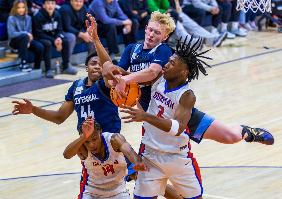 Centennial's Cooper Jenkins (30)battles for a rebound with Bishop Gorman's Jett Washington (2) ...