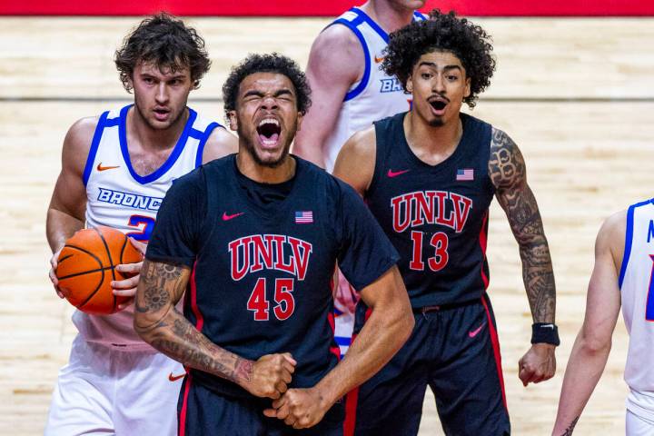 UNLV forward Jeremiah Cherry (45) yells out after a big dunk over Boise State Broncos forward T ...