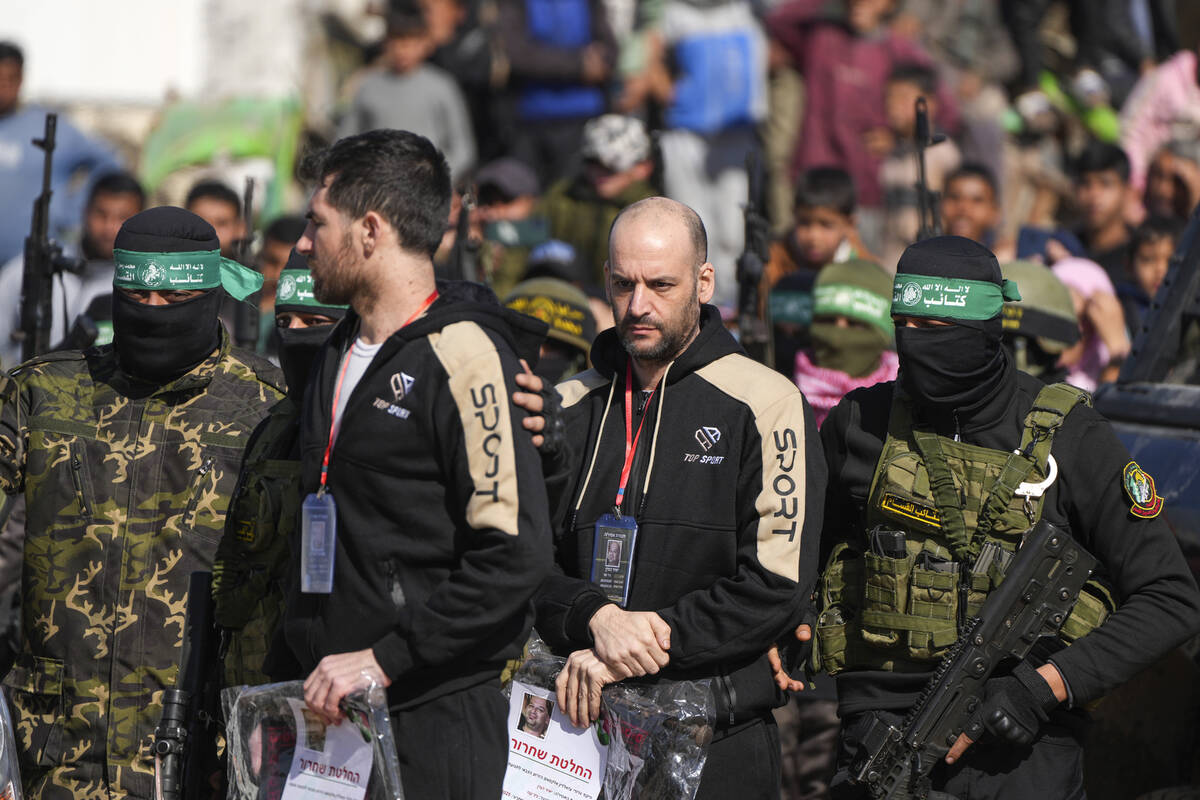 Hostages Iair Horn, 46, Israeli-Argentine, center, and Sagui Dekel Chen, 36, left, Israeli-Amer ...