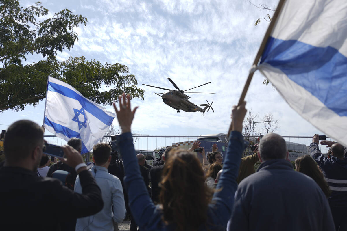 An Israeli military helicopter carrying two freed hostages from Hamas captivity in Gaza, Americ ...