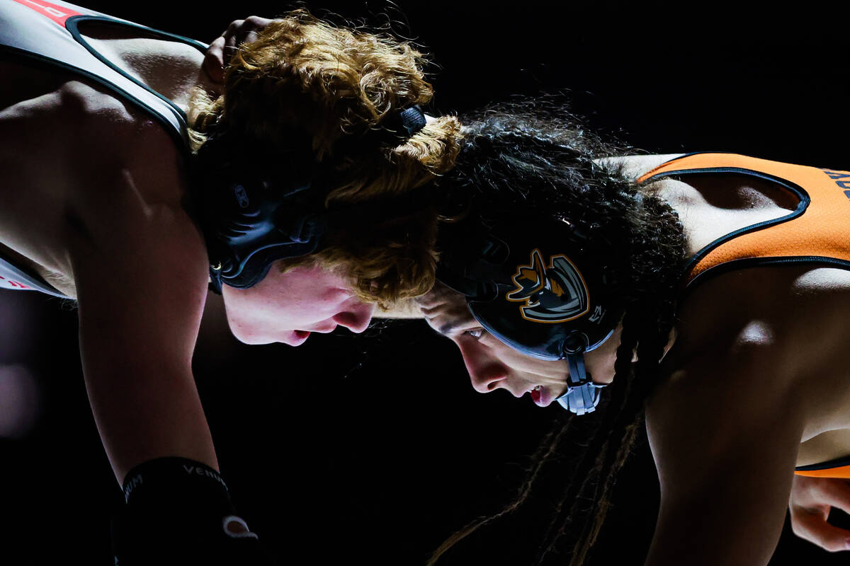 Desert Oasis wrestler Chance Mannino goes head-to-head with Chaparral wrestler Vicente Tizoc du ...