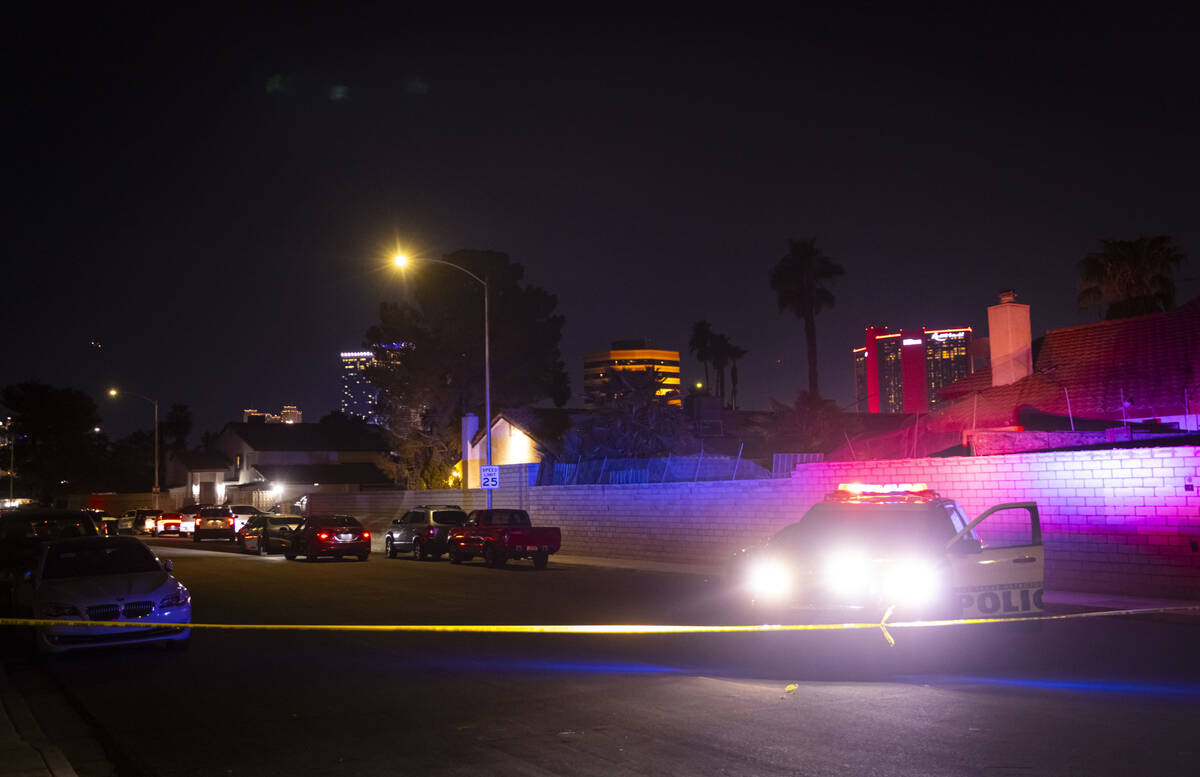 Las Vegas police respond to a homicide off Naco Court as seen from Paseo Del Prado near Sahara ...