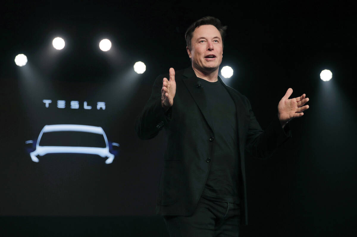 FILE- Tesla CEO Elon Musk speaks before unveiling the Model Y at Tesla's design studio, March 1 ...